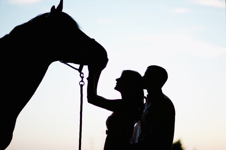 a person standing in front of a sunset