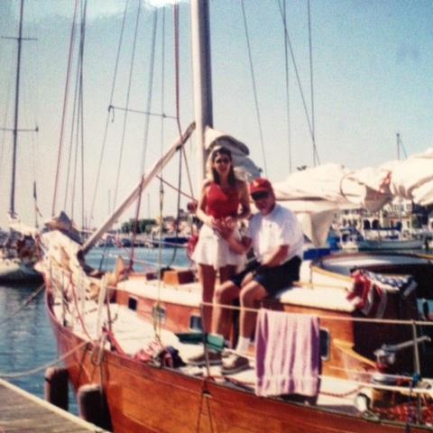 a group of people in a boat on a body of water