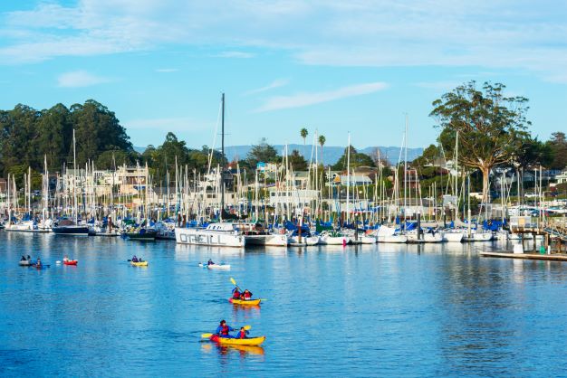 a harbor filled with lots of small boats in a body of water